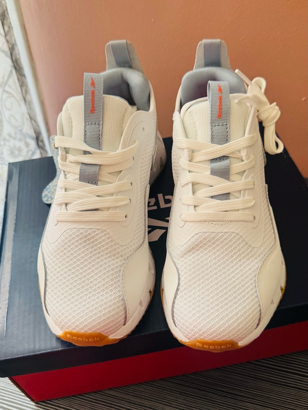 Woman’s Reebok Dynamica Zig White,light blue Sneakers with Orange Toe Accents